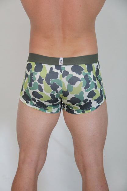 Green and black camouflage patterned men’s briefs with olive green waistband featured in camouflage trunk product