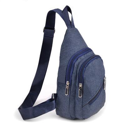 Navy blue canvas sling bag with denim texture and multiple silver-toned zippered compartments for easy access