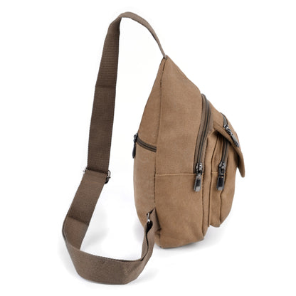 Tan canvas sling bag with multiple zippered compartments and sturdy adjustable shoulder strap for easy carrying