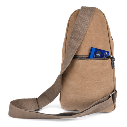 Canvas sling bag in tan with adjustable shoulder strap and front zippered pocket holding a blue visa card