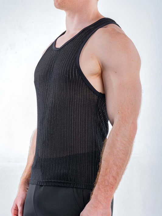 Side view of a person wearing a black mesh tank top with a scoop neckline and ribbed trim.