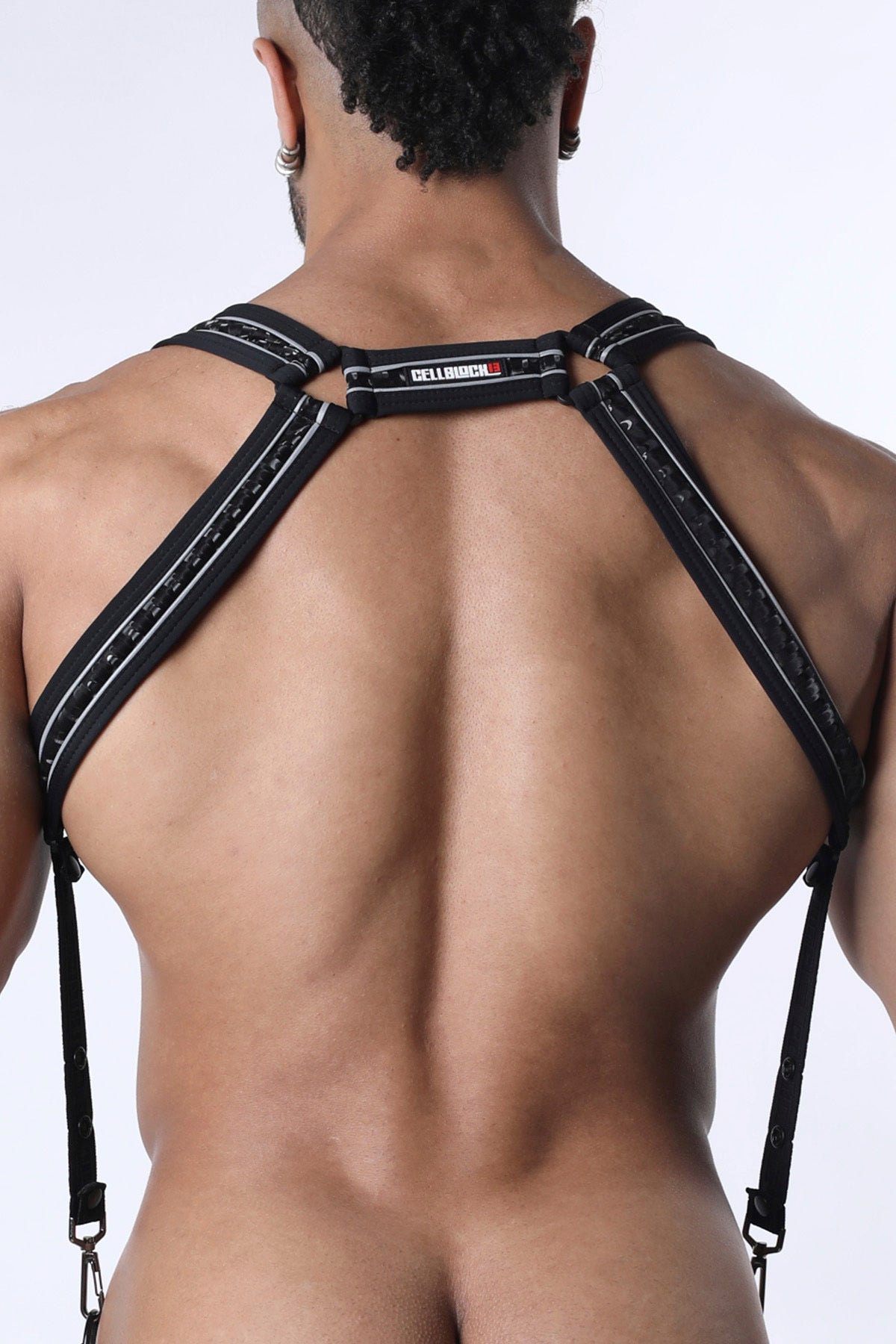 Back view of carbon shadow body harness with black lace-trimmed suspenders and silver stitching featuring cellbio label