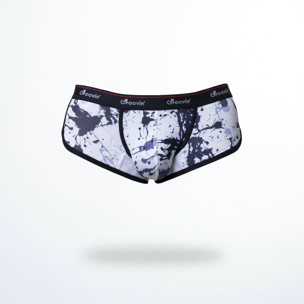 White briefs with black purple paint splatter and groovin branded black elastic waistband groovin underwear splatter art cup boxer