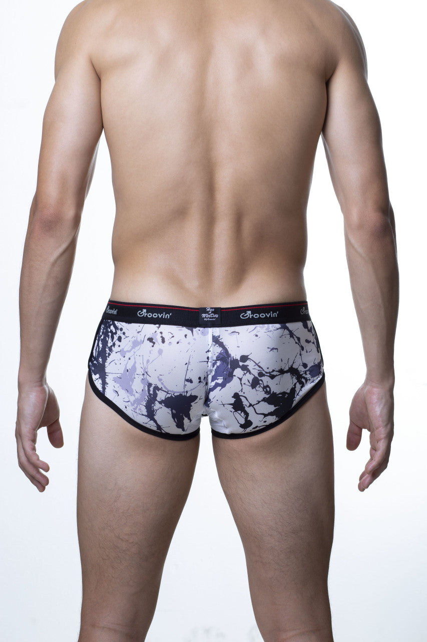 White and black splatter-patterned men’s briefs with dark groovin elastic waistband in groovin underwear splatter art cup boxer black cbp1802