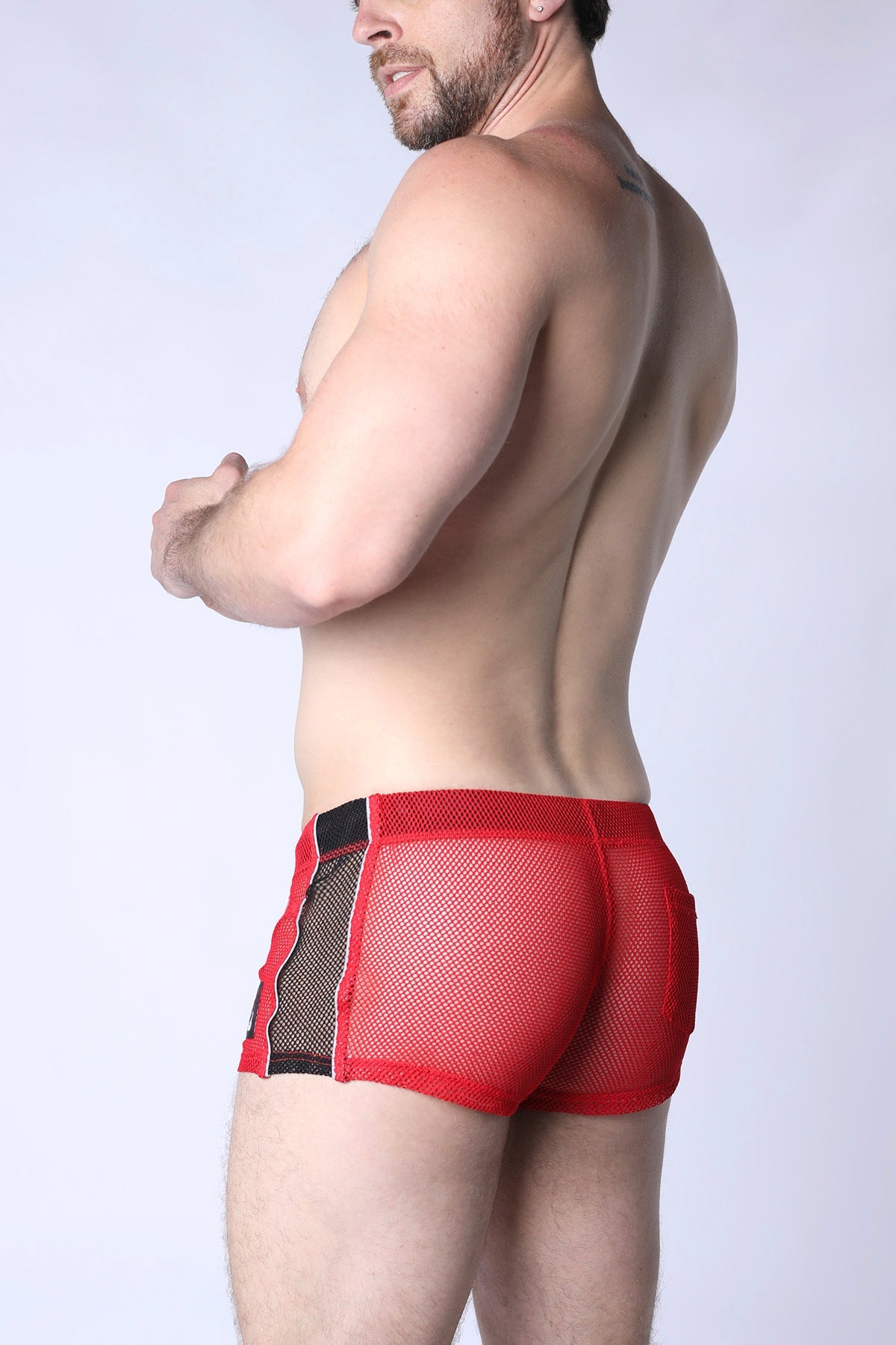 Red mesh briefs with black side panels from chain reaction mesh short featuring breathable mesh material