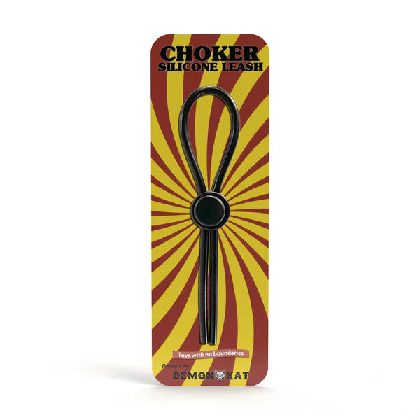 Black silicone choker leash with central circular ring packaged in red and yellow sunburst design