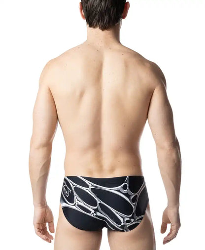 Black swim trunks with bold white abstract organic pattern from the chromium bikini collection designed for swimming