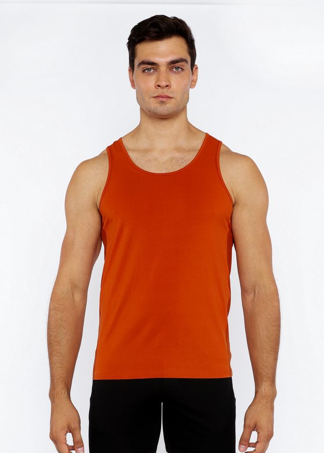 A solid orange sleeveless stretch jersey tank top with circle spine laser cut and a simple round neckline