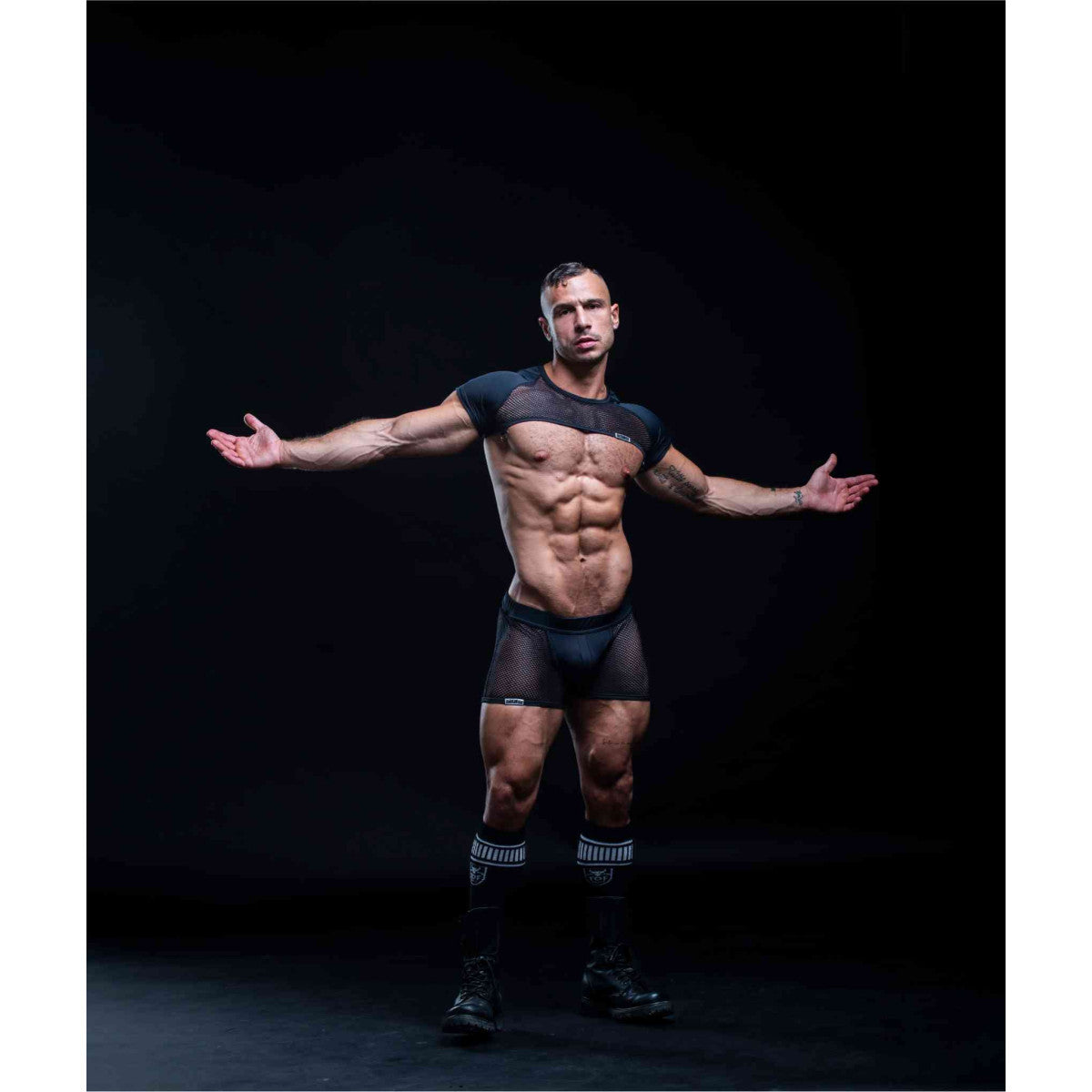 Black mesh athletic top with short sleeves and matching mesh jockshort designed for circuit training