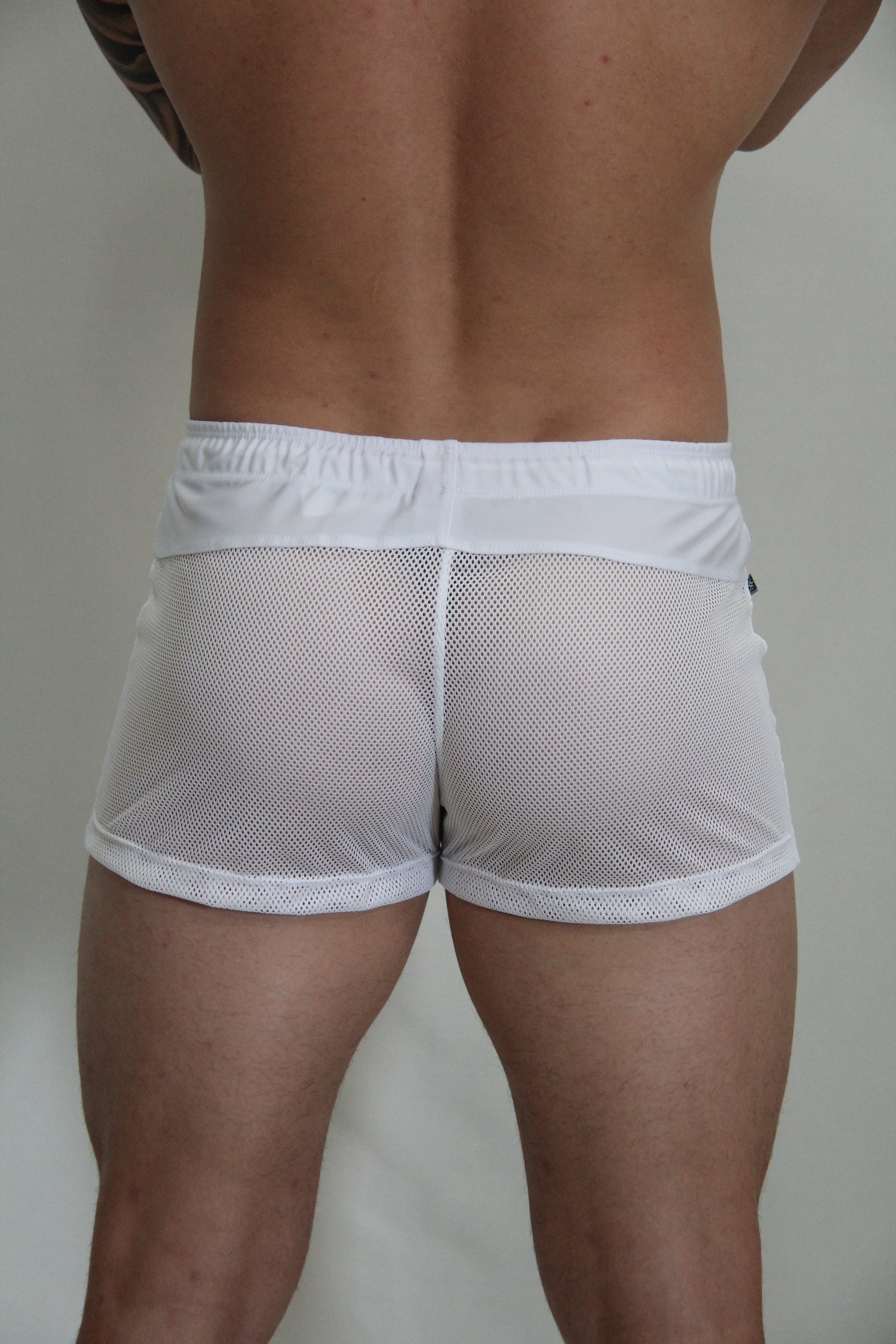 White mesh athletic shorts with solid white elastic waistband from circuit mesh short 4 colors available collection
