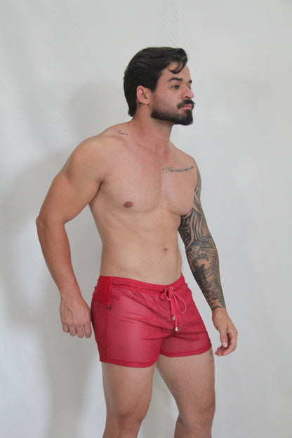 Red circuit mesh short swim trunks with white drawstring ties made of breathable mesh fabric for active use