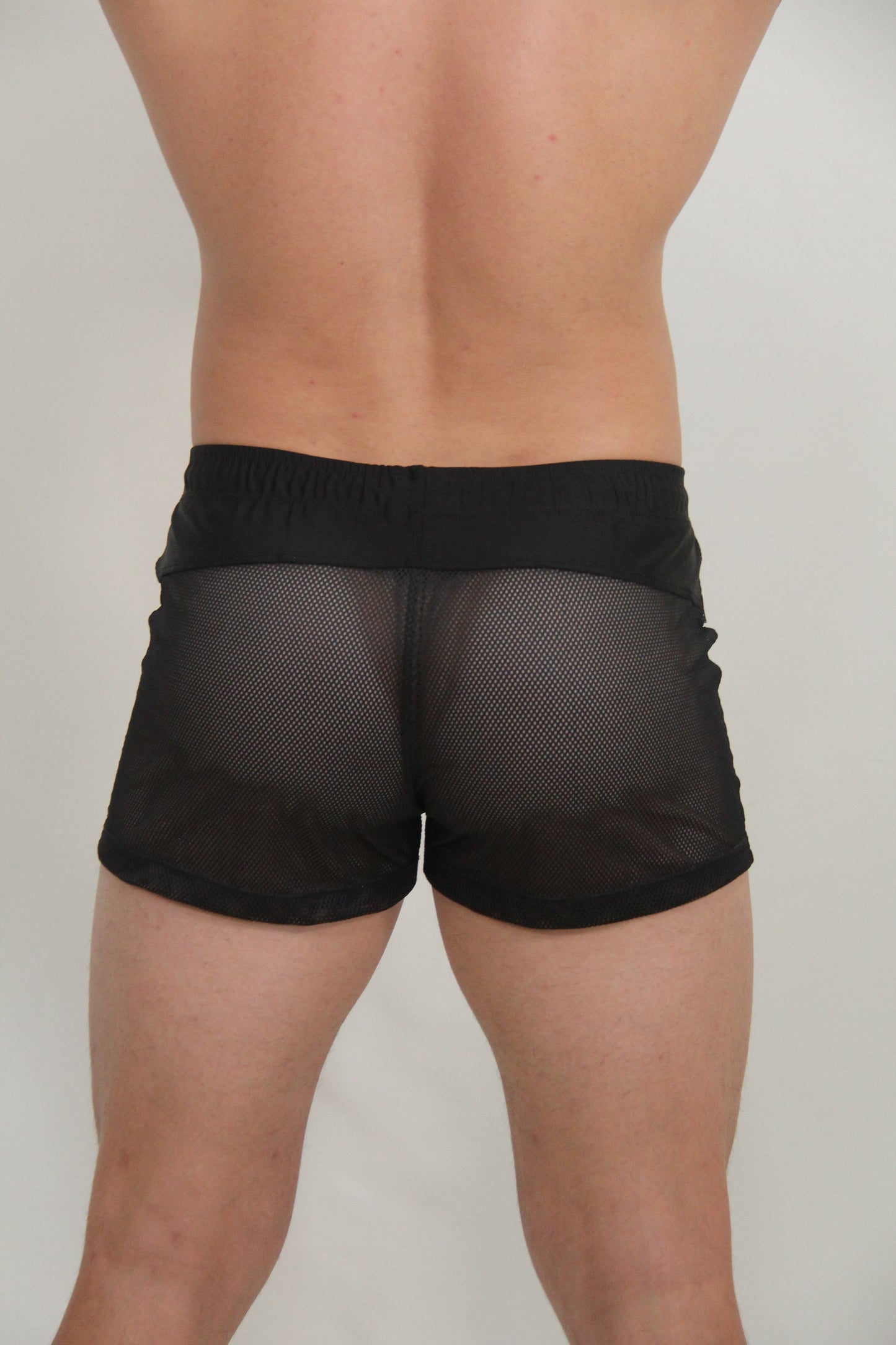 Black mesh shorts with solid black waistband from circuit mesh short collection available in four colors
