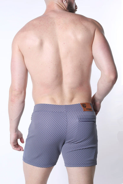 Clemente swim short limited edition blue patterned swim trunks with subtle geometric design and brown leather waistband patch