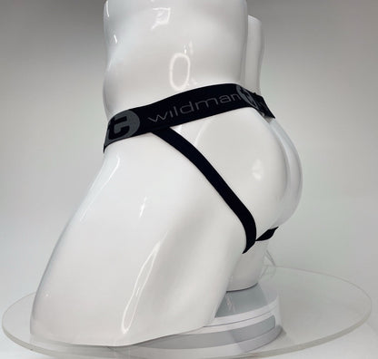 WildmanT Big Boy white jockstrap on a white mannequin featuring a black elastic waistband with brand logo branding.