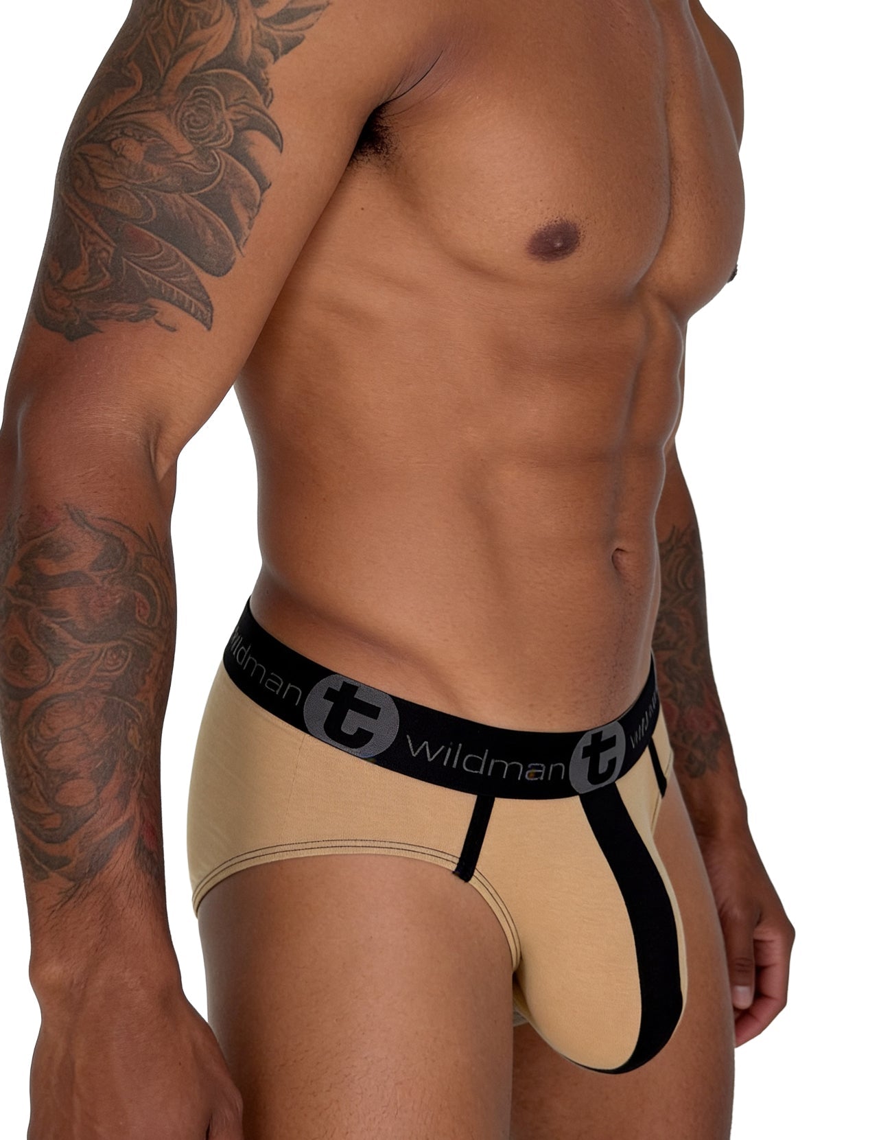 Tan cotton brief with a black pouch stripe and black elastic waistband featuring the Wildman logo.