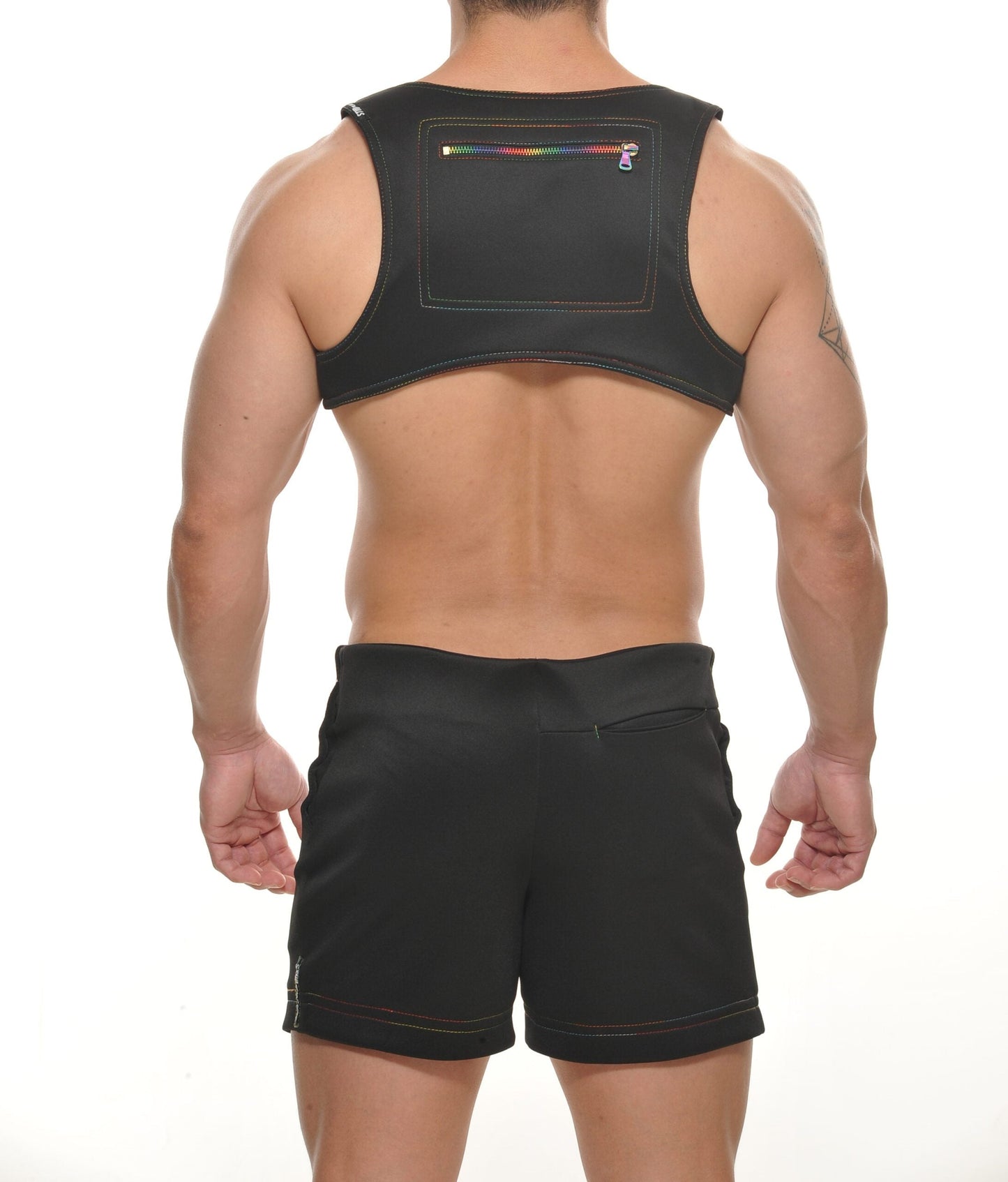 Black sleeveless neoprene vest harness back with rectangular zippered pocket and rainbow-colored zipper pull