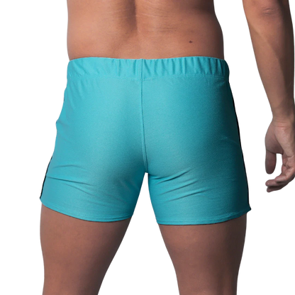 Back view of turquoise blue fitted athletic shorts with a textured honeycomb fabric and an elastic waistband.