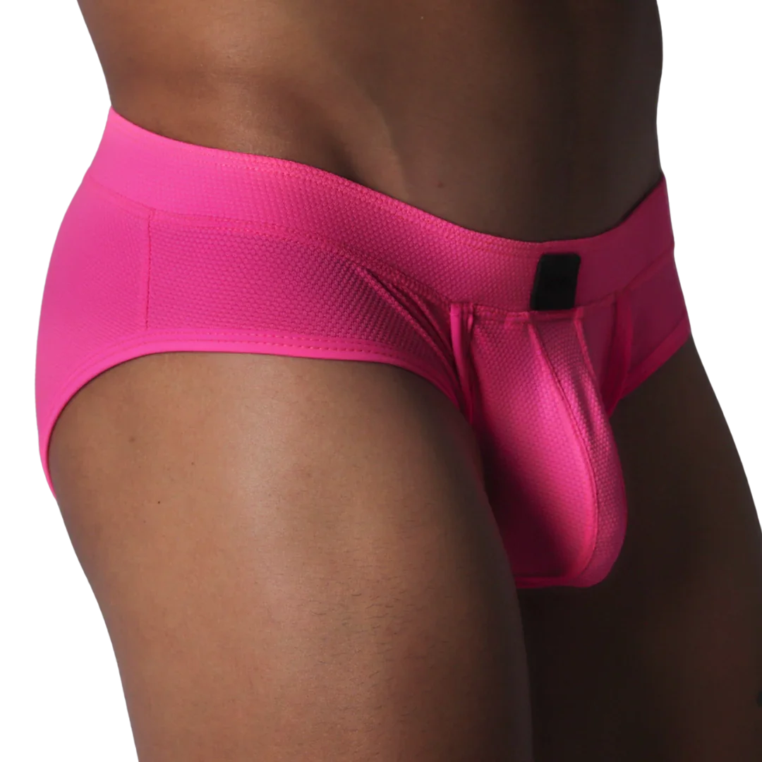 Fuchsia brief in textured, honeycomb-patterned fabric featuring a contoured pouch and a small black rectangular logo.