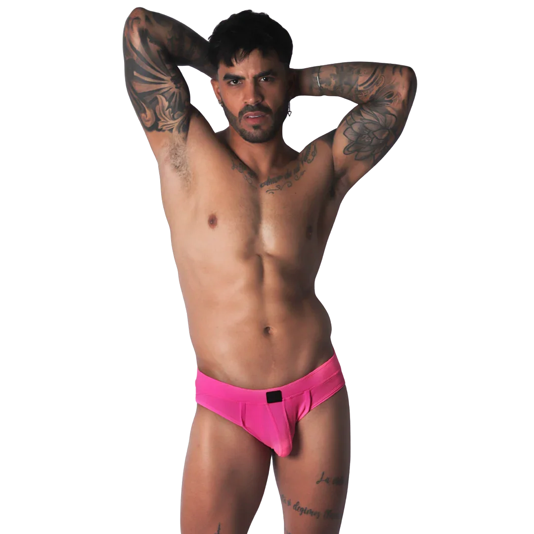 Fuchsia jockstrap brief with a smooth, matte finish and a central black logo detail on the waistband.