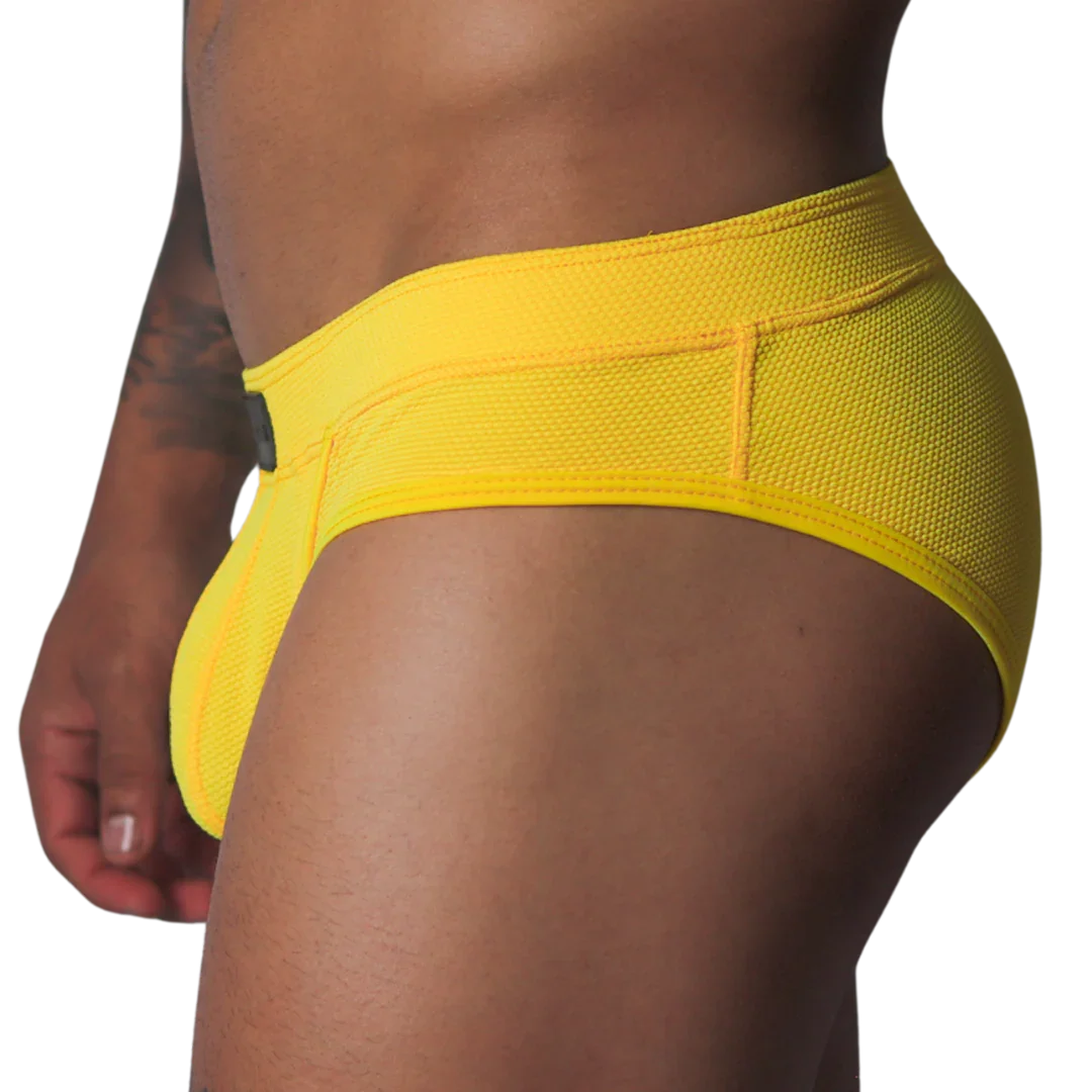Bright yellow low-rise brief in textured, breathable honeycomb mesh fabric with a wide supportive waistband.