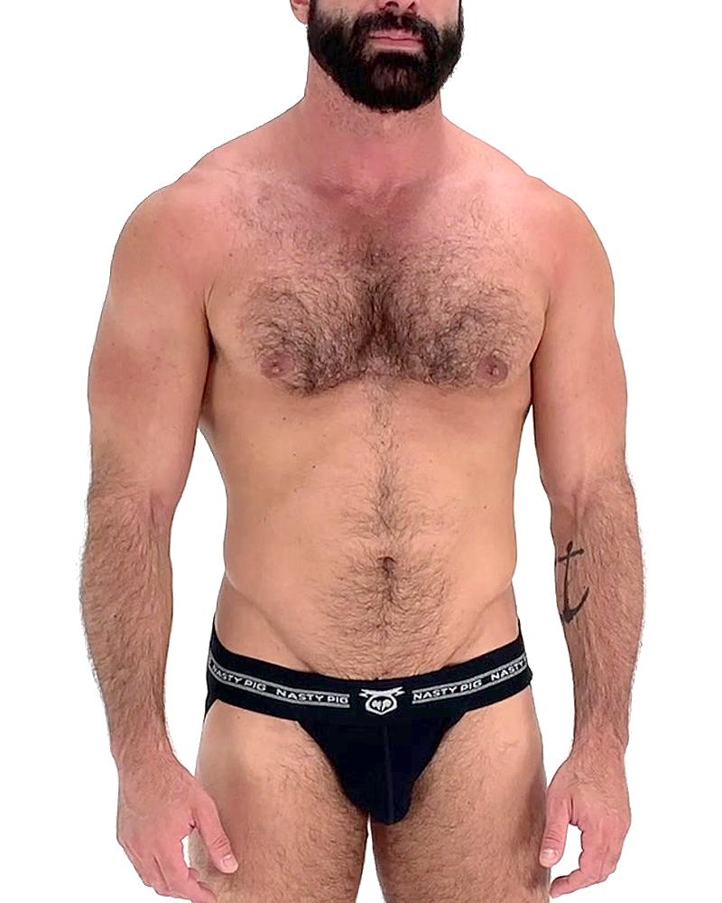 Black nasty pig brand core jockstrap briefs with white logo and text on waistband in a black fabric design