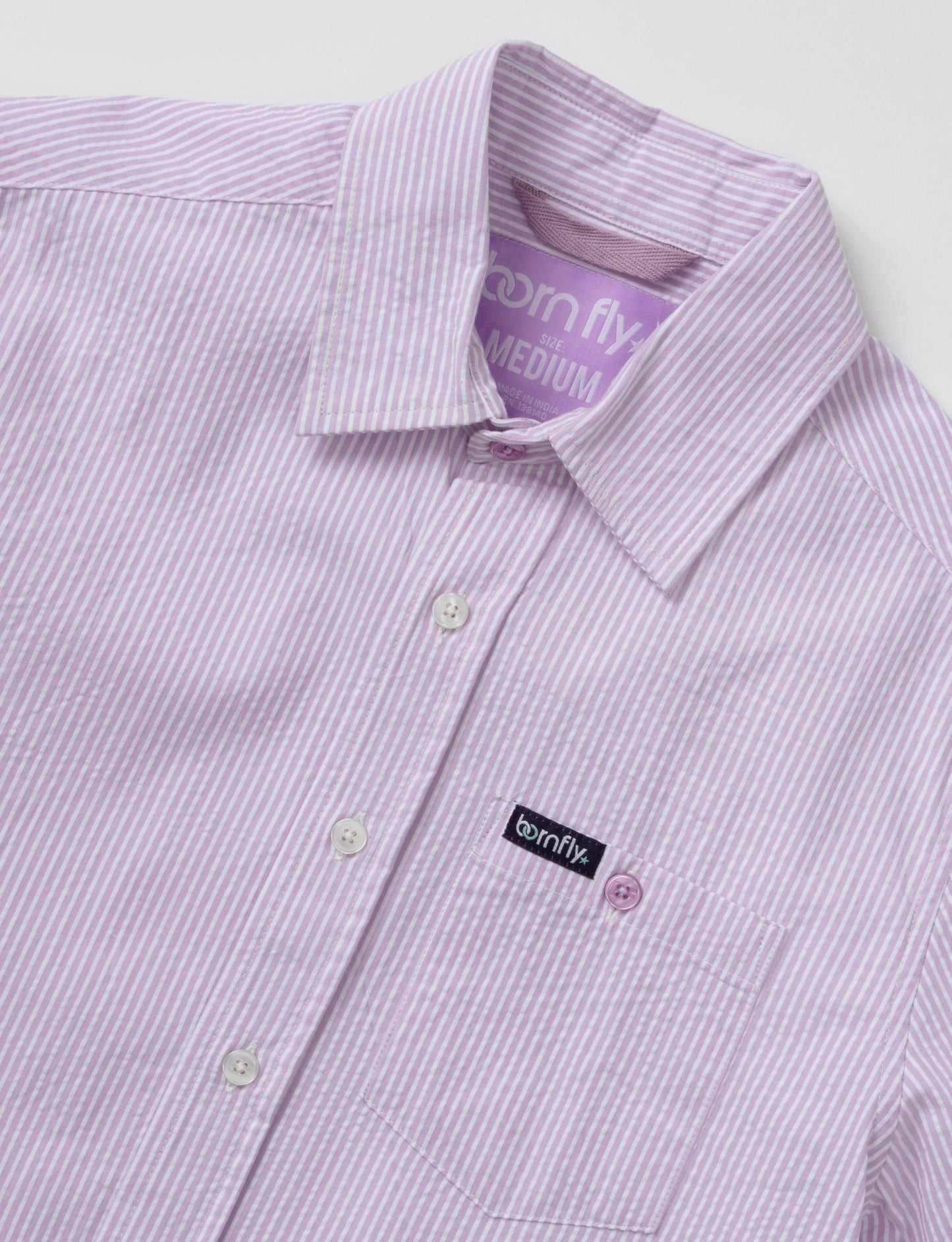 Country club fly seersucker shirt with lavender and white stripes textured fabric and born fly brand label on collar and pocket