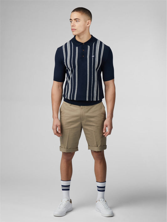Navy blue and white vertically striped crinkle cotton short-sleeved polo shirt with small embroidered logo on chest