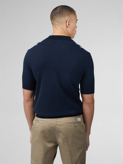 Navy blue crinkle cotton stripe polo shirt with short sleeves and white logo trim along the shoulders