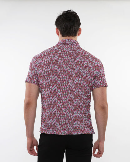 A man wearing a crinkle knit short sleeve shirt in pink gray and white marled texture visible from the front