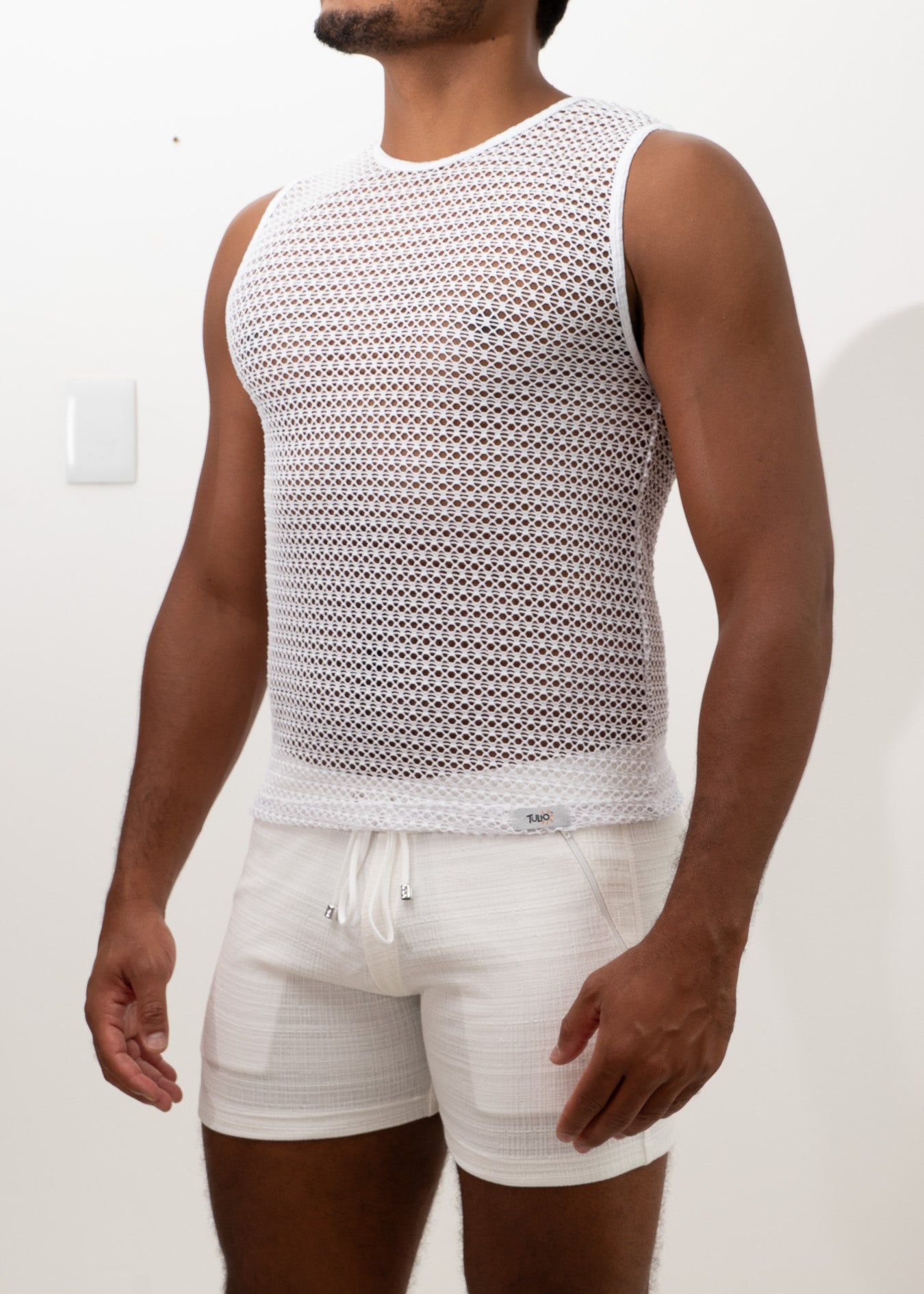 White crochet muscle tank top with sleeveless design round neckline and subtle mesh patterned texture