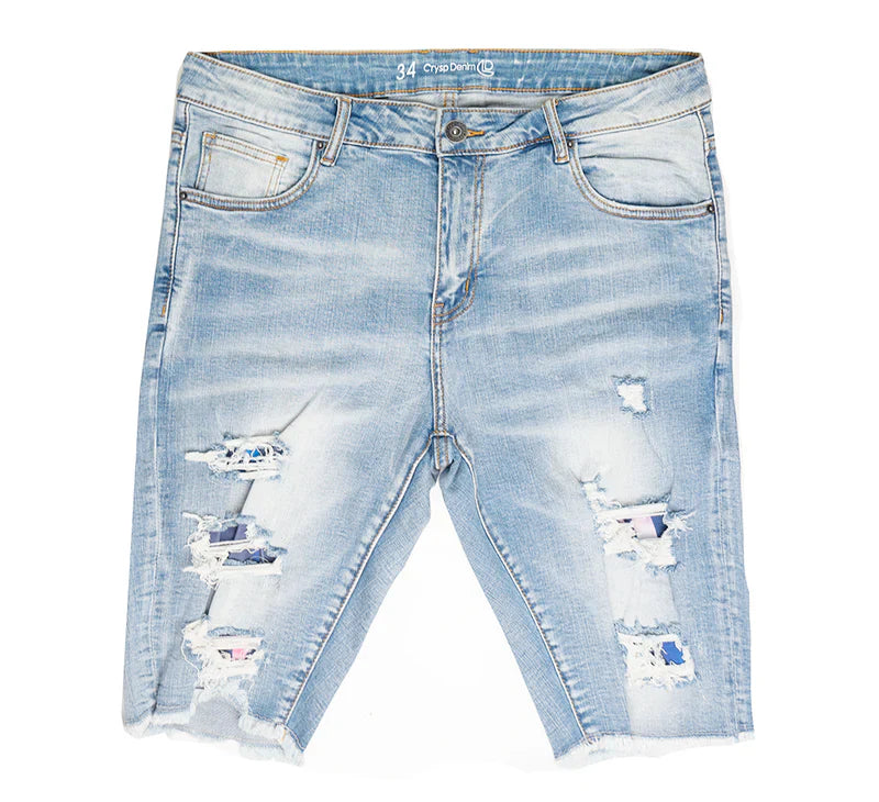 Light-wash CRYSP denim cut off short with distressed ripped details and frayed hems made from denim material