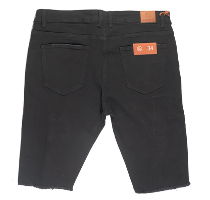Back view of crysp denim cut off short black slim fit denim shorts with two back pockets and orange brand tags
