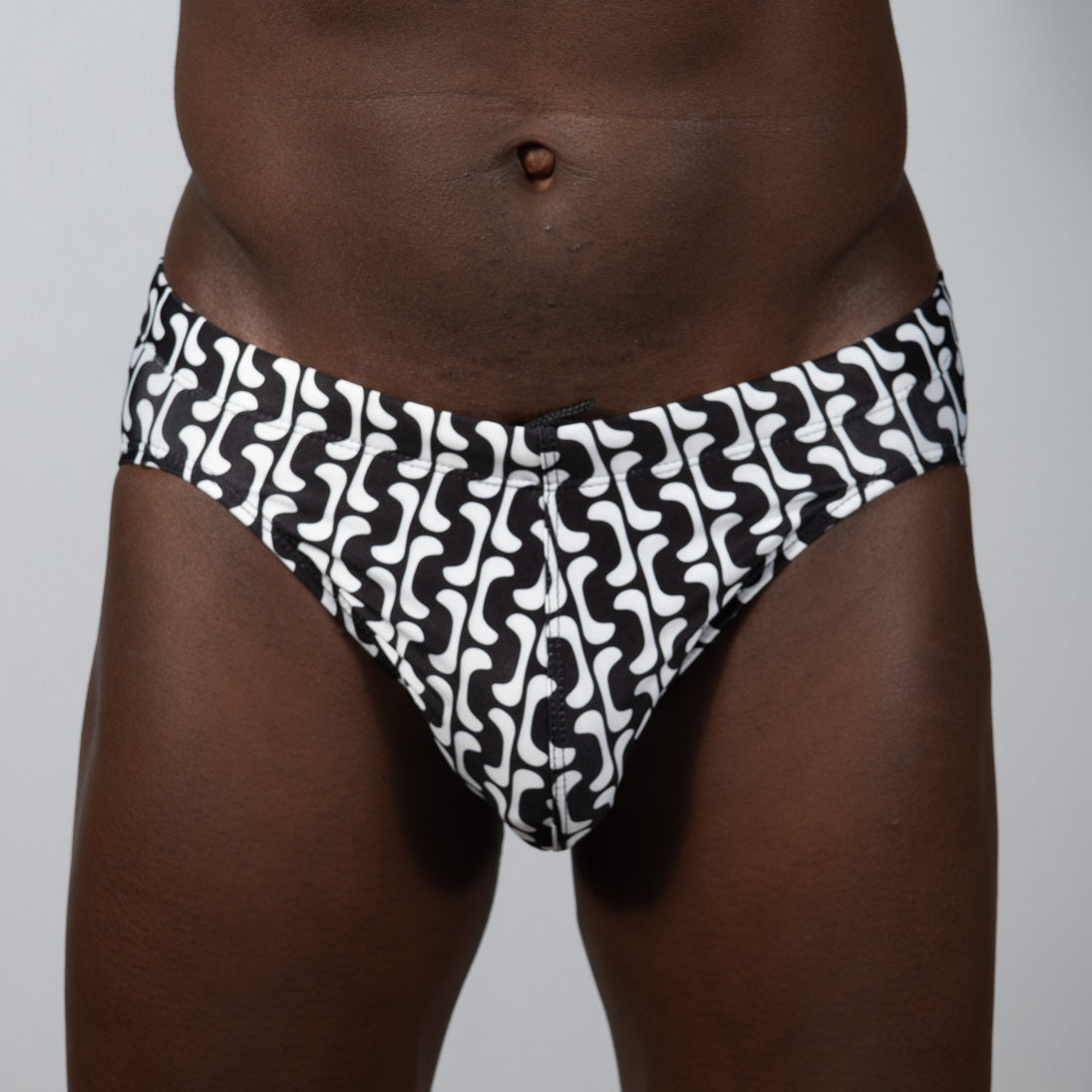 Black and white swim trunks with a bold wavy geometric print in curves print brief design