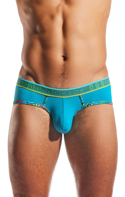 Bright turquoise Cocksox CX76N Supplex sports briefs with green patterned waistband and tropical print leg edges