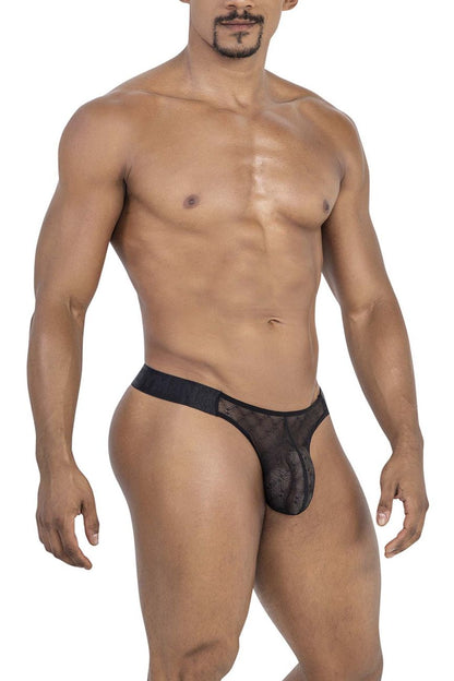Black candyMan 99771 mesh thong with sheer patterned design and solid waistband shown from the back side