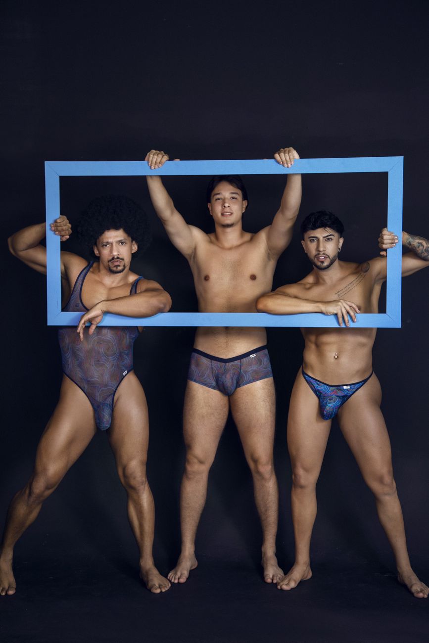 Three men holding a blue rectangular frame featuring CandyMan 99873 multicolor print seawater trunks product display