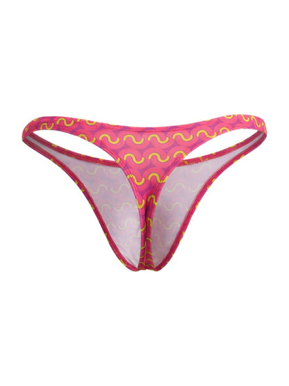 A vibrant pink CandyMan 99924 thong with bold yellow wavy pattern and sheer mesh lining front view