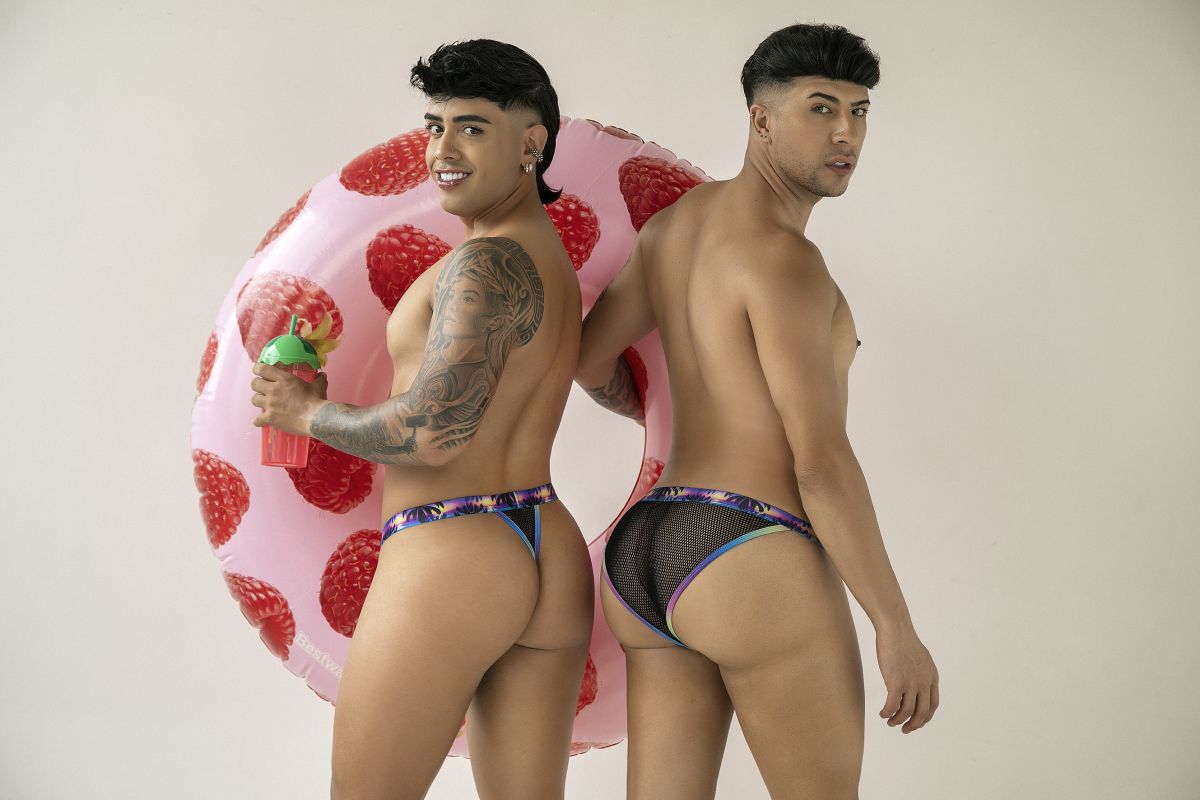 Pink inflatable strawberry pool float shown with black CandyMan 99936 thongs for poolside use