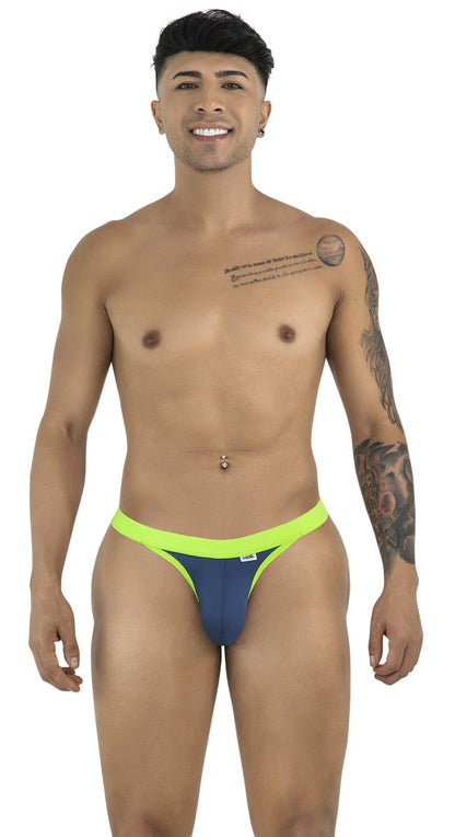 CandyMan navy blue thong with a bright lime green waistband and trim, worn by a man.