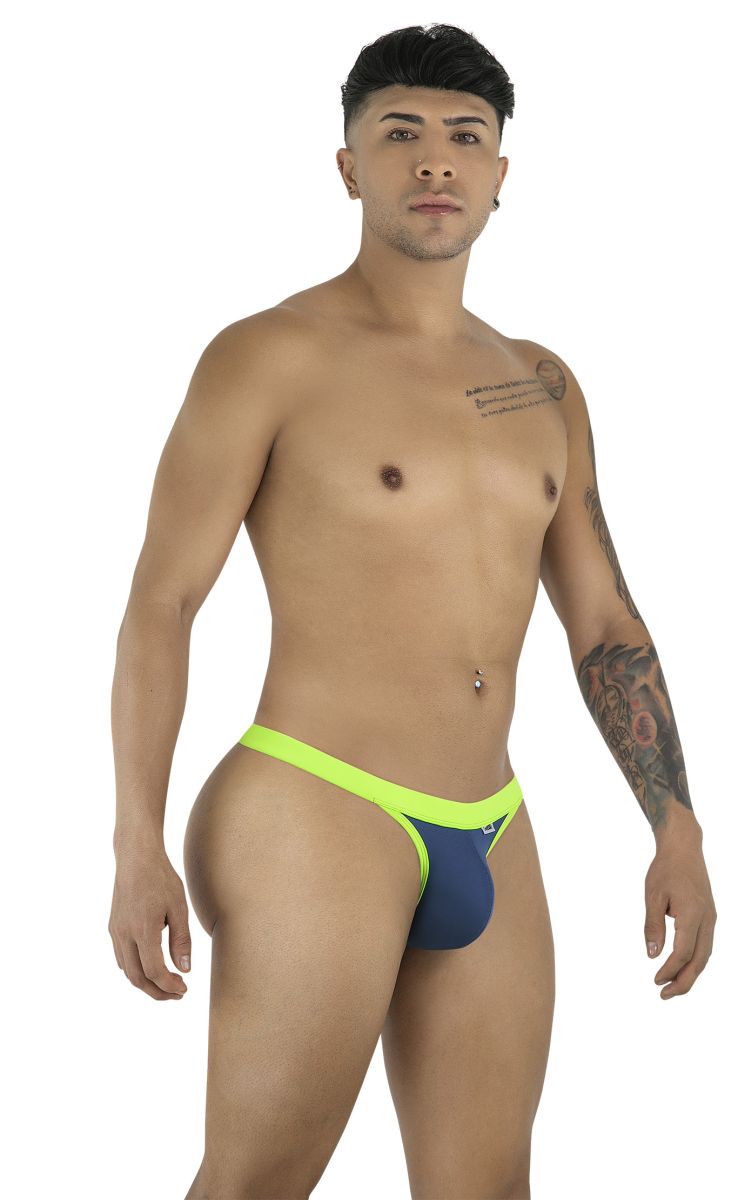 CandyMan navy blue thong featuring neon yellow trim and a contoured pouch, worn by a male model.