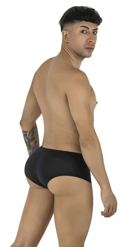 Model wears black CandyMan 99943 trunks featuring a form-fitting, smooth fabric design with a short-cut leg.