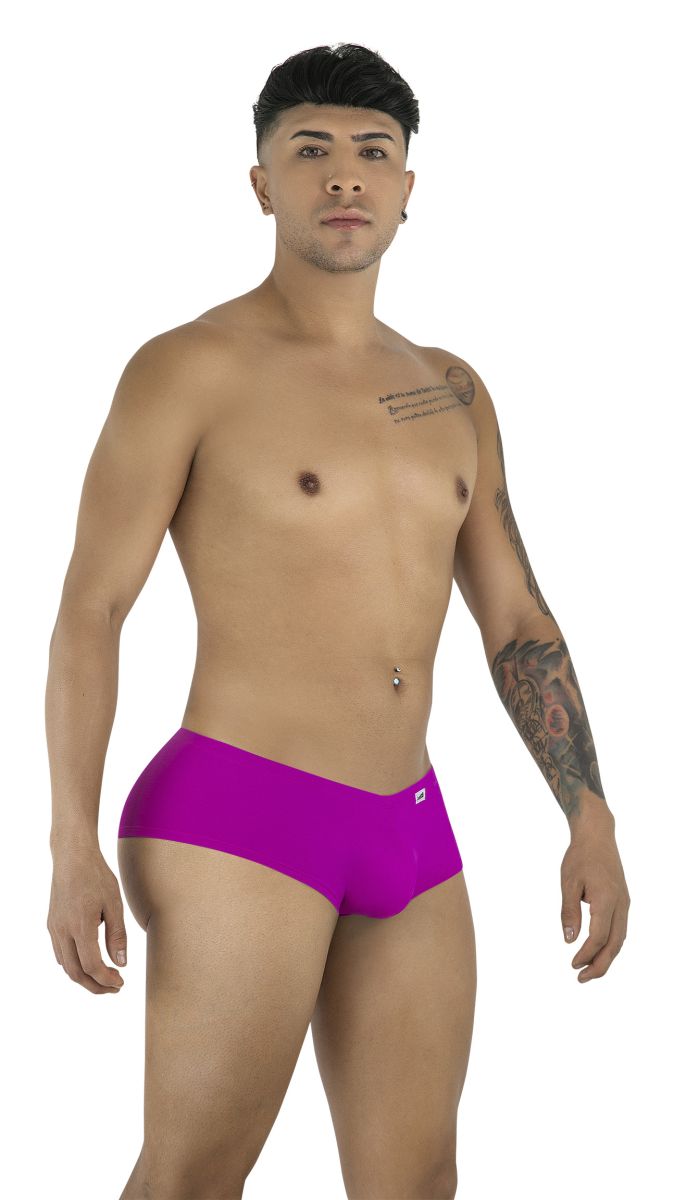 Model wearing CandyMan 99943 magenta trunks with a smooth fabric finish and a minimal, low-rise athletic cut.