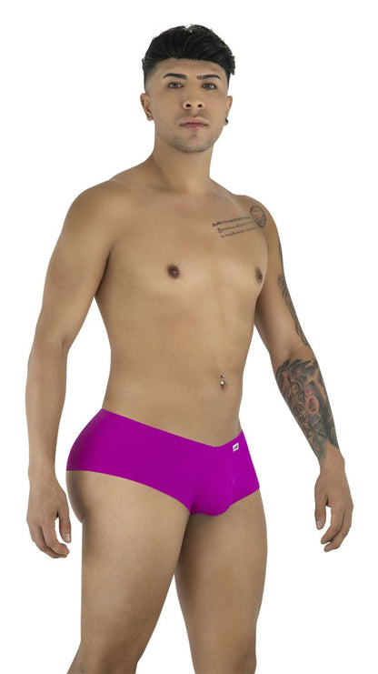 Model wearing CandyMan 99943 magenta trunks with a smooth fabric finish and a minimal, low-rise athletic cut.
