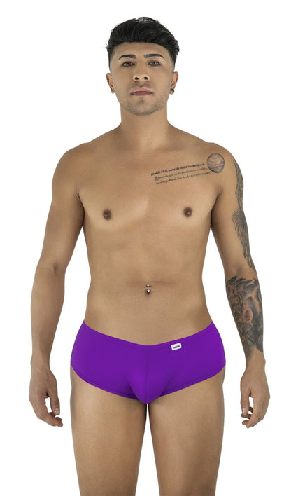 A man wears CandyMan 99943 orchid-colored trunks with a low-rise, form-fitting cut and a small logo tag.
