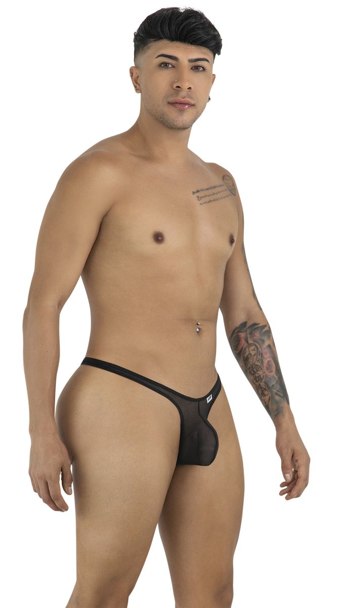 A man wears a black CandyMan 99954 thong in sheer, lightweight mesh fabric with a slim waistband.