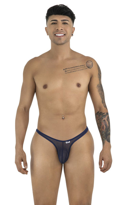 A man models CandyMan navy mesh thongs with a thin double-strap waistband and a minimalist pouch design.
