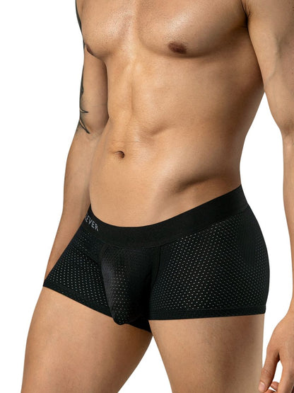 A man wears black mesh trunks with a wide, branded elastic waistband.