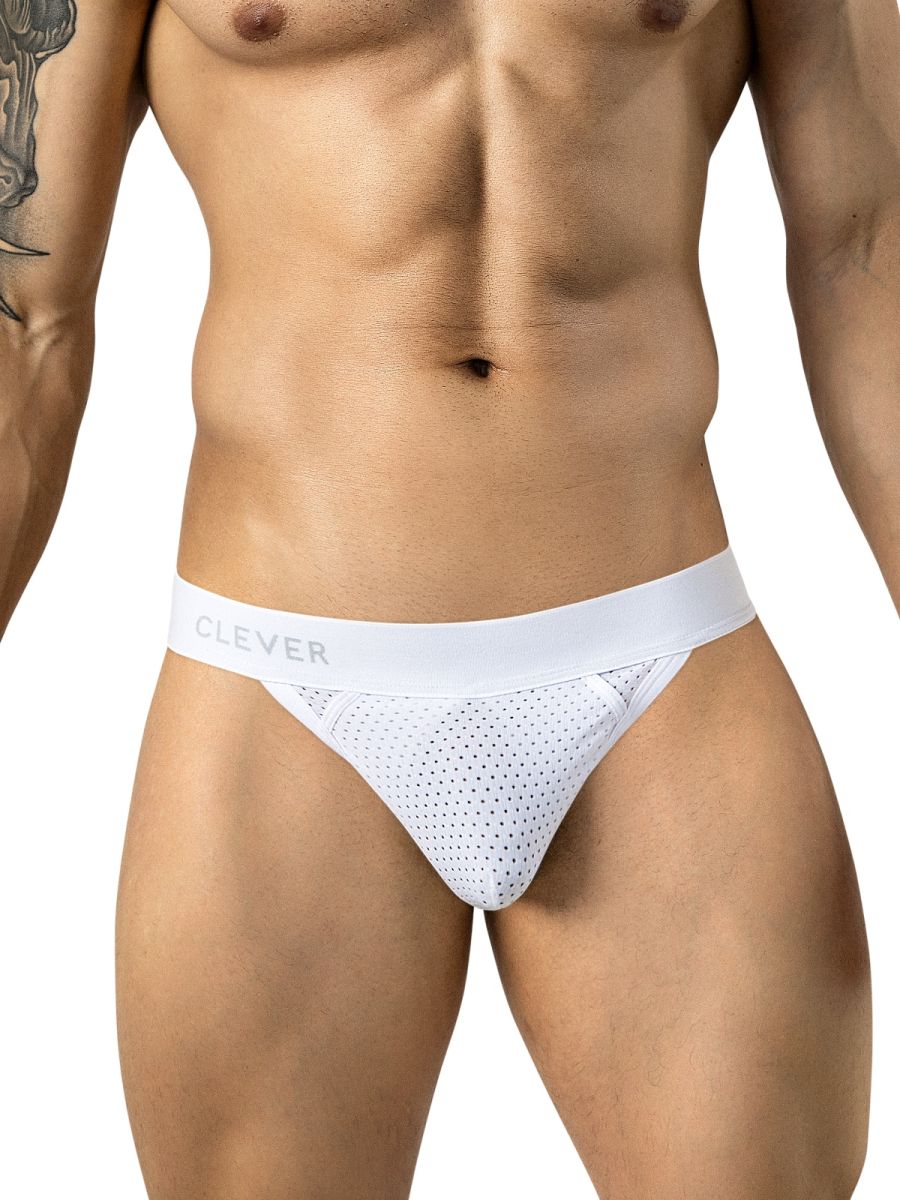 A man wears white mesh thong underwear featuring a branded elastic waistband.