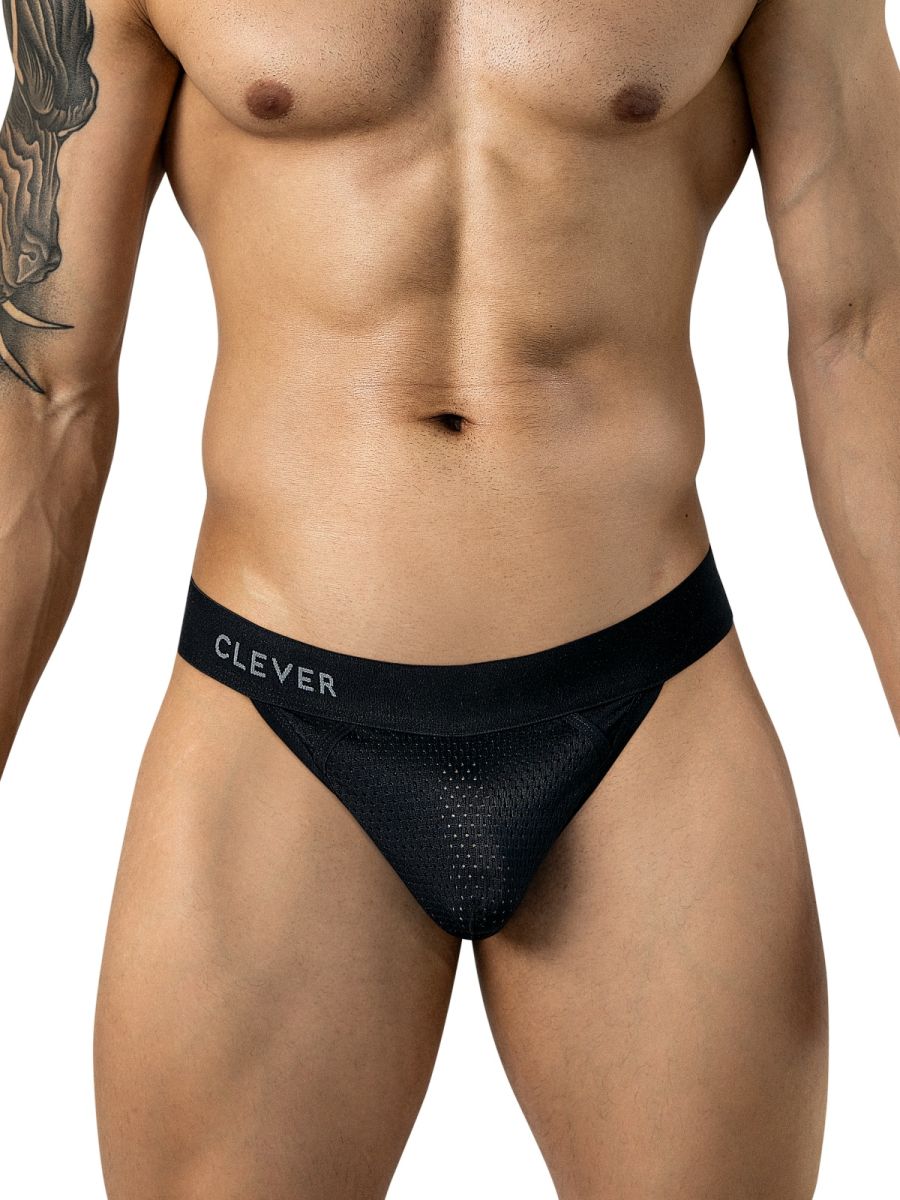 A man wears black mesh thong underwear featuring a branded waistband.
