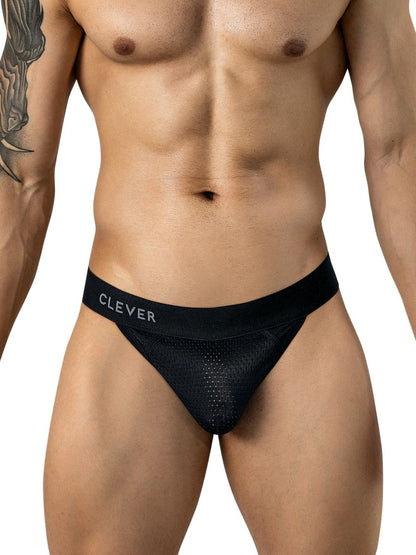 A man wears black mesh thong underwear featuring a branded waistband.
